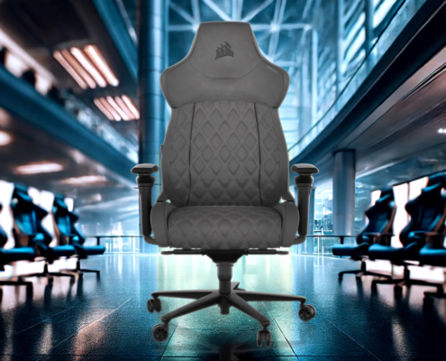 Corsair TC500 Luxe Black Gaming Chair displayed in a modern, blurred office background with cool tones and dynamic lighting.