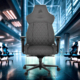 Corsair TC500 Luxe Black Gaming Chair displayed in a modern, blurred office background with cool tones and dynamic lighting.